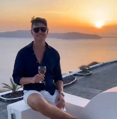 Luke-sipping-wine-in-Greece